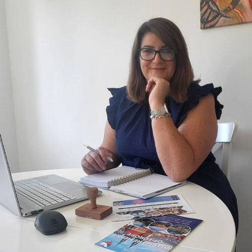 Lindie Van As , co-founder of Live New Life, providing senior care consultancy at her office desk.